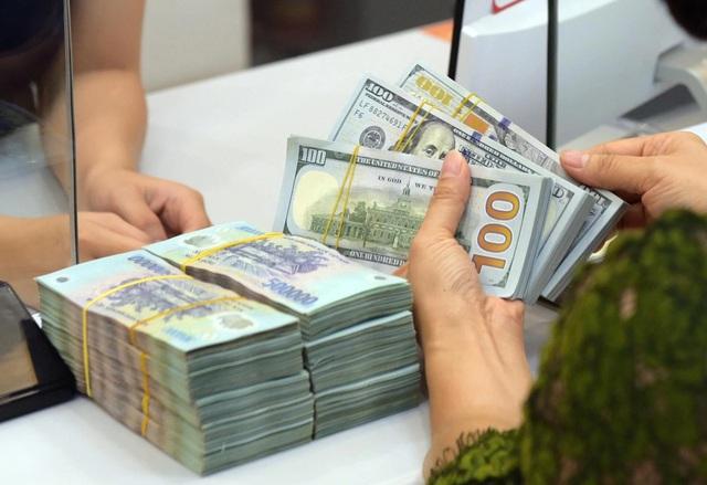 Giá USD tăng, lãi suất chịu áp lực- Ảnh 1.